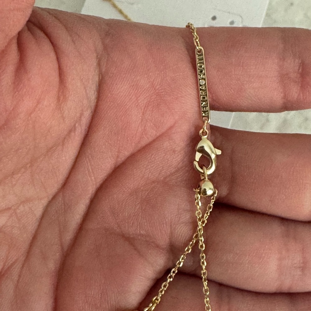 Kendra Scott 14k Plated Gold and Orange Sandstone Football Pendant Necklace - Picture 7 of 13